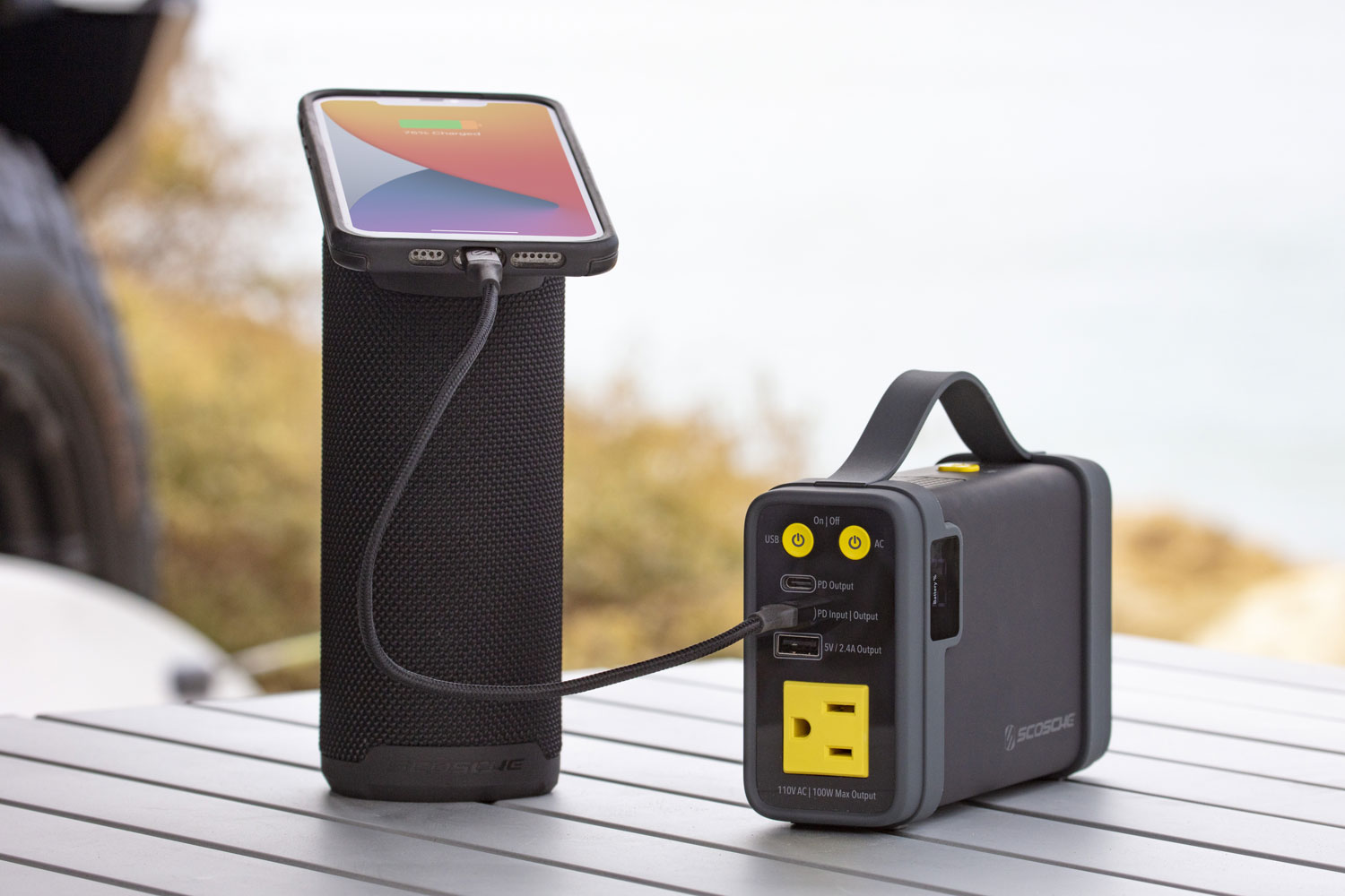 iphone charging via Scosche portable power station while mounted to MagSafe portable bluetooth speaker