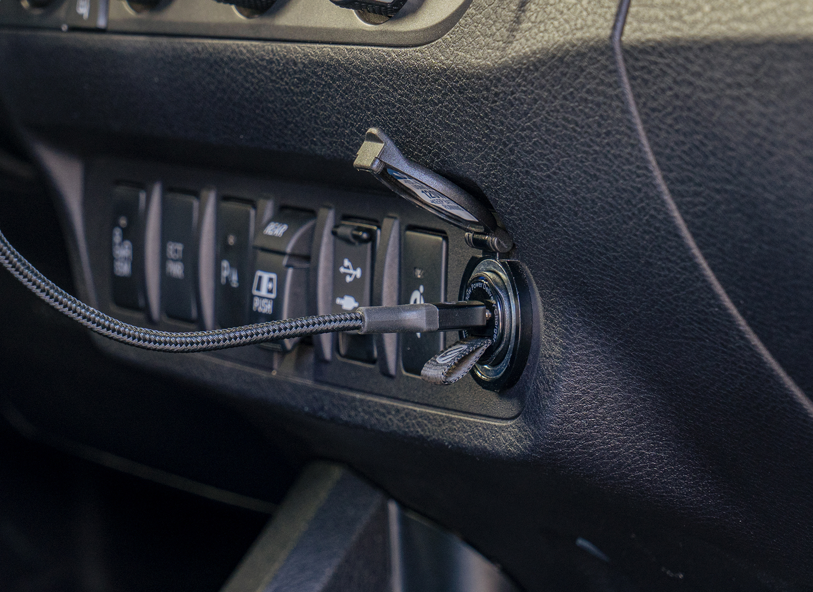 close up of Scosche braided cable in car charger