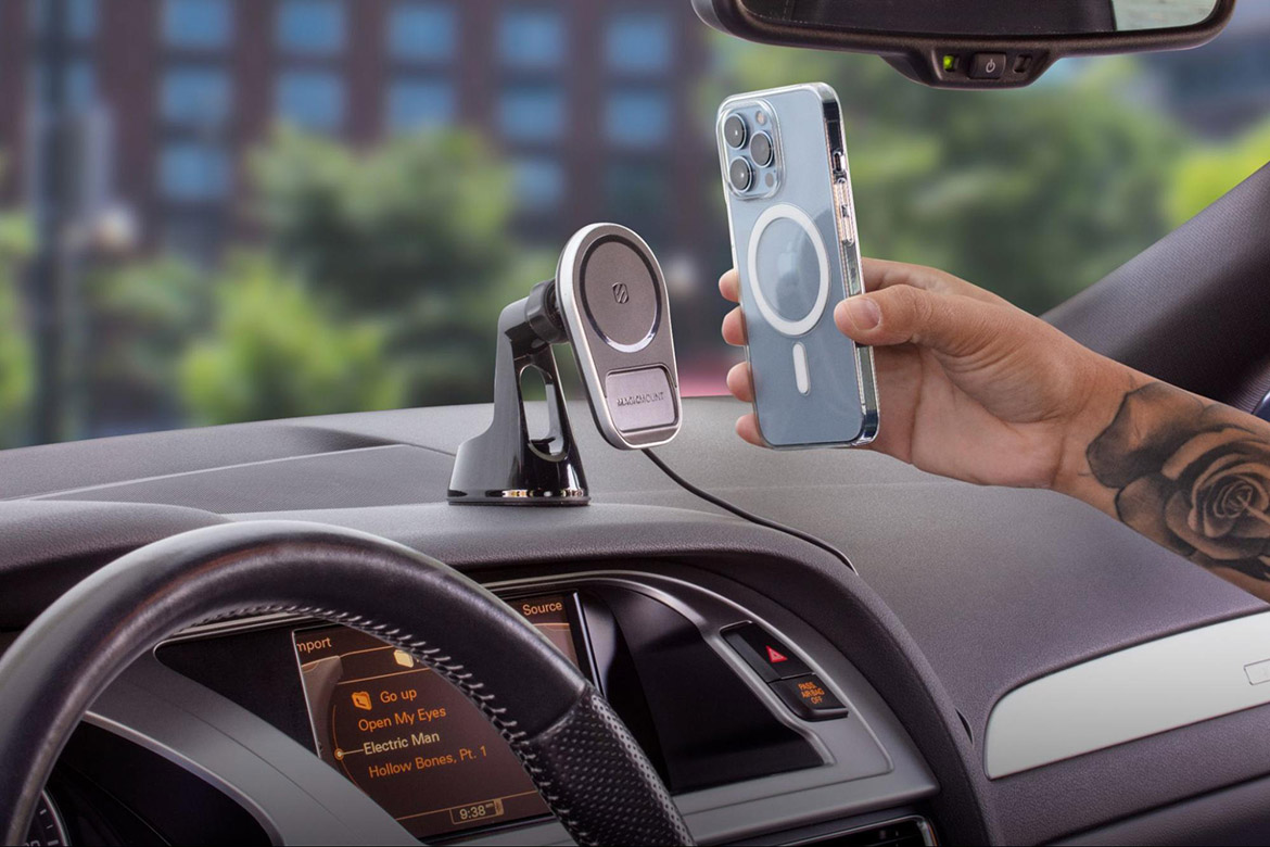 magnetic mount man hovering iphone over MagSafe wireless charging dash mount